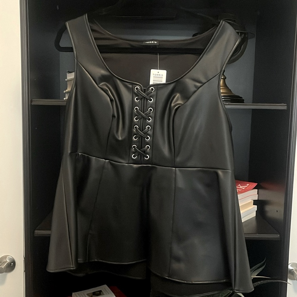 Torrid, leather like peplum top. Size Large, never worn!